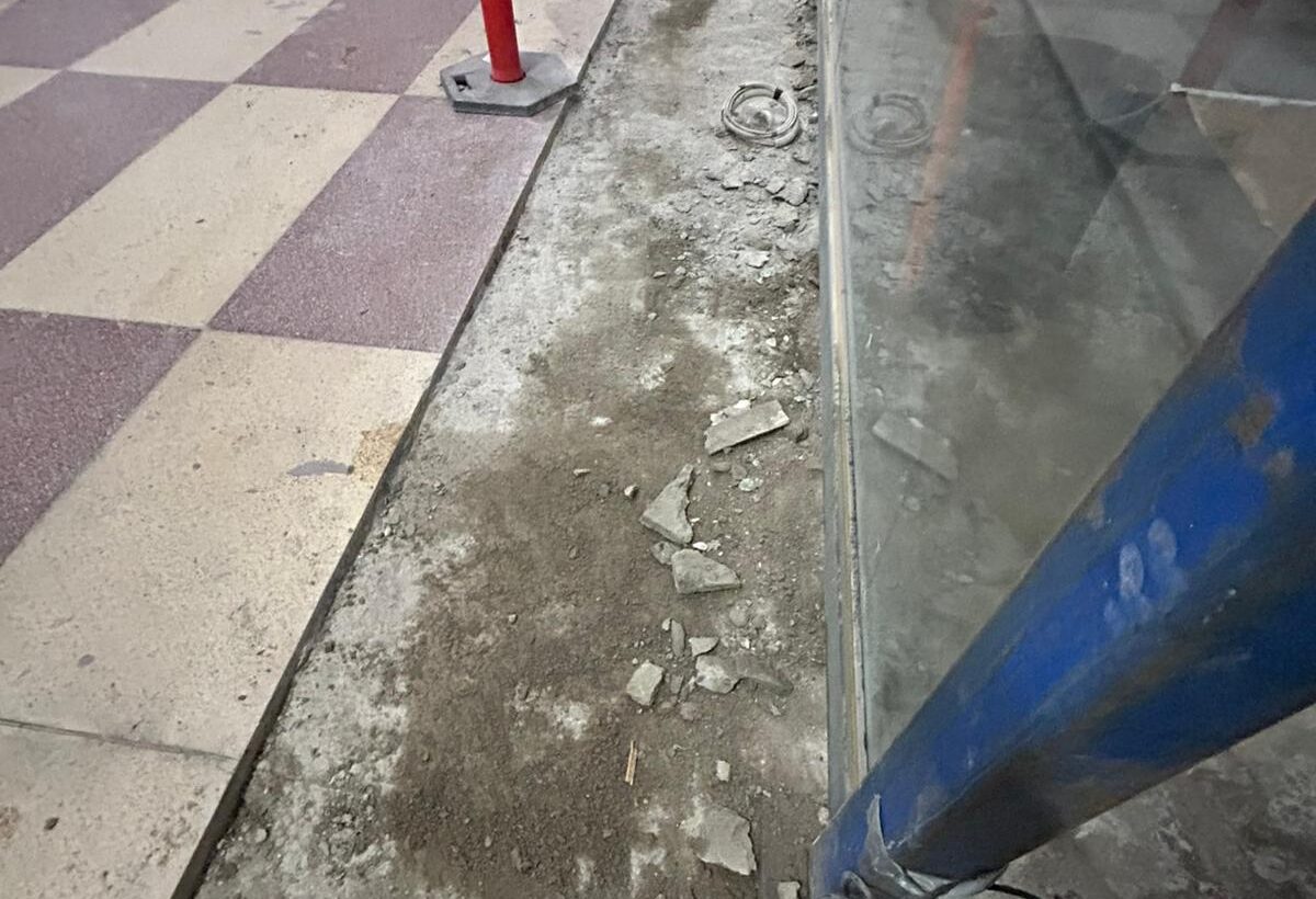 floor preparation service, grinding part of the floor is done and some still has tiles